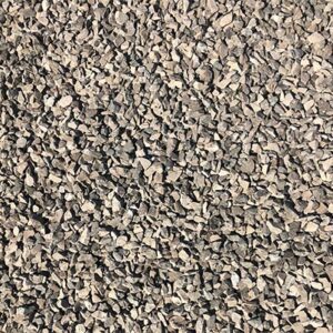 A close-up view of a large pile of small, rough-edged gray stones, likely used for construction or landscaping purposes. No people or landmarks visible.