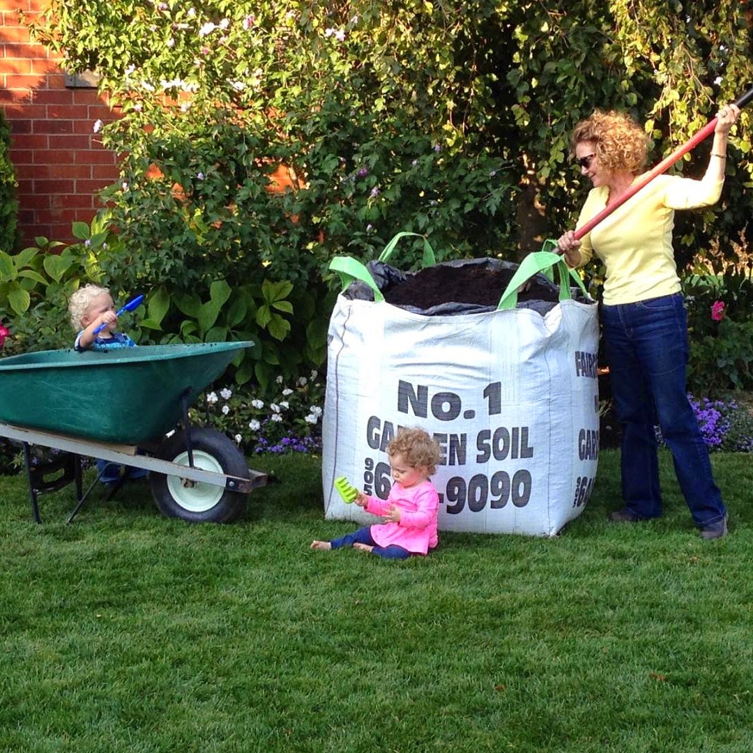 Woman gardening with Fairgreen sod soil